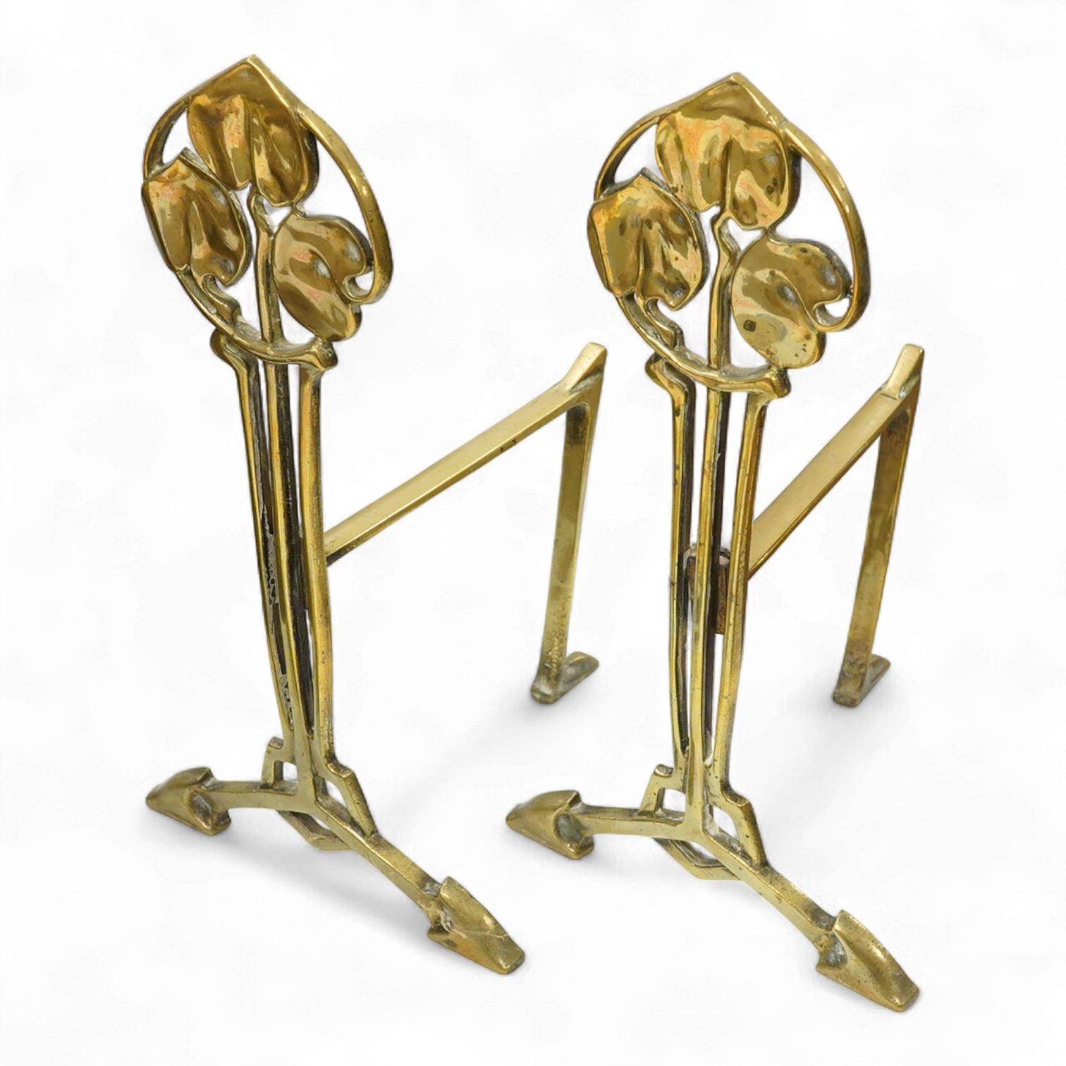 A pair of Art Nouveau brass firedogs, 35cm high